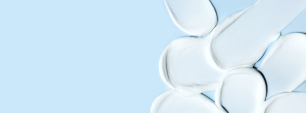 化妆品涂抹膏状纹理在蓝色的背景图片下载