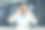 特写照片。一个微笑的亚洲年轻人坐在办公室的桌子前，把眼镜戴在脸上，看着镜头图片下载