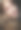 美丽的女人与化妆在粉红色的色调。年轻的女性模型与辫子在黑色的背景。图片下载