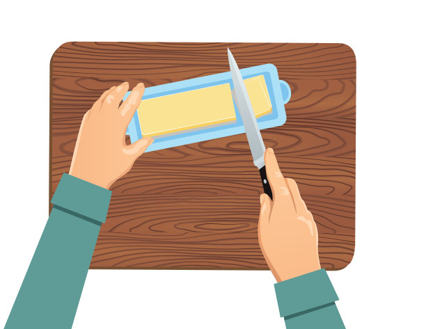 在透明的背景上，双手切割一根黄油棒的俯视图图片下载