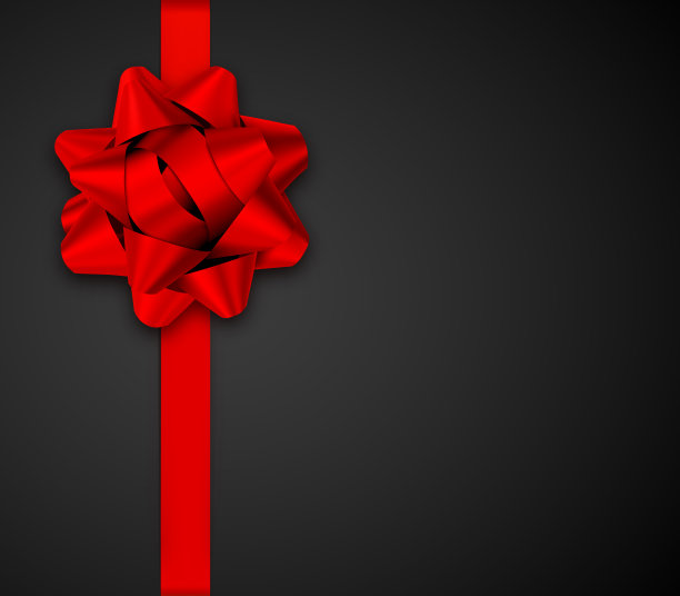 红色礼品蝴蝶结与缎带上的黑色背景图片下载