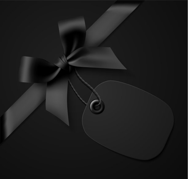 黑色礼品蝴蝶结与黑色标签在黑色背景图片下载