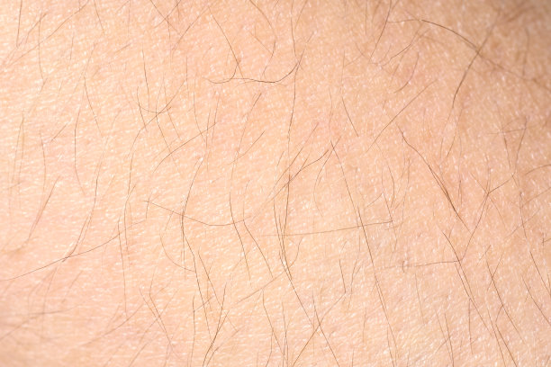 粉红色皮肤纹理的背景。健康的皮肤。皮肤细胞的微距照片。图片下载