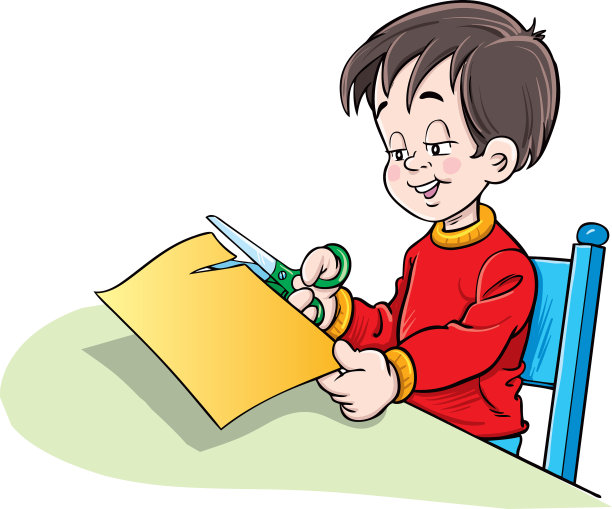 男孩用剪刀剪彩色纸图片下载