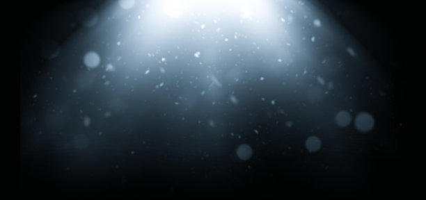 蓝色光束中的尘埃粒子和散景图片下载