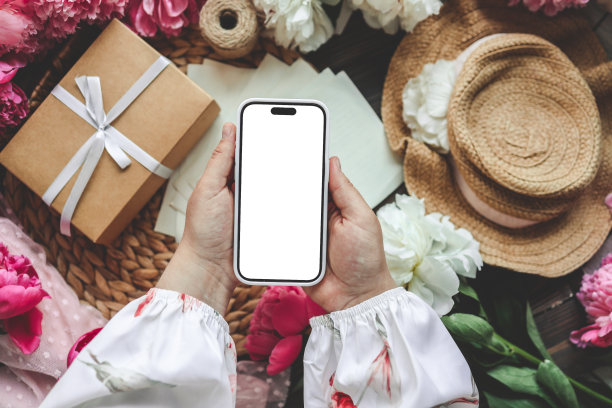 手机和春花牡丹以喜庆为背景。主题是爱，母亲节，妇女节平平安安图片下载