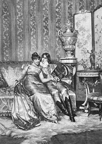 一对相爱的小情侣坐在沙发上图片下载