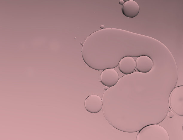 油和水泡沫玫瑰色的背景。图片下载