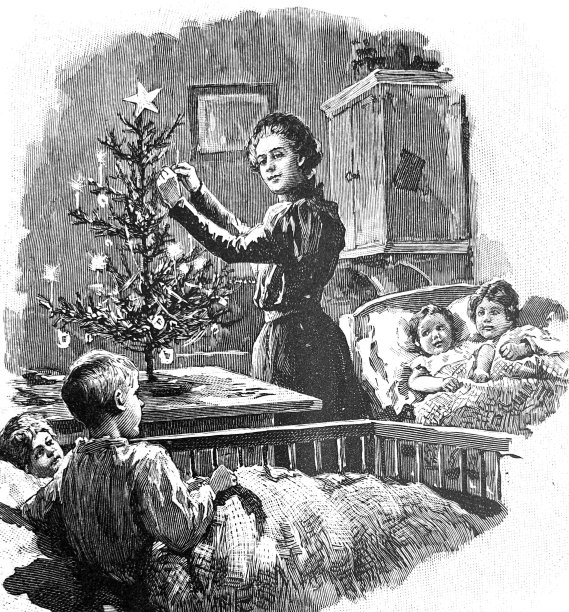 妈妈在孩子们的卧室里熄灭了小圣诞树上的蜡烛图片下载