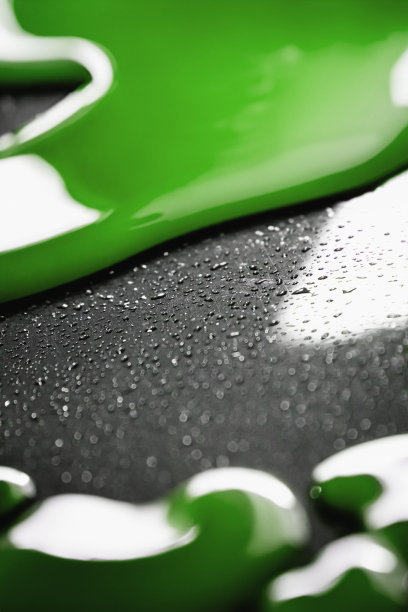 绿色抽象液体，彩色奇幻背景配以绿色黏液和小颗粒图片下载