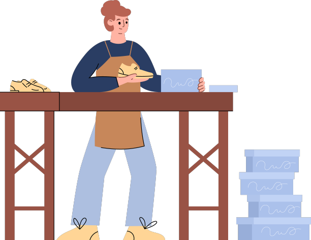 女鞋匠把手工鞋装在盒子里图片下载