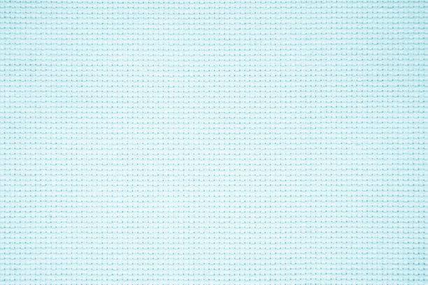 蓝色织物纹理的特写为背景。图案颜色蓝色浅牛仔布无缝剪裁服装，天然棉麻材质纺织针织艺术在夏季。帆布工业。图片下载