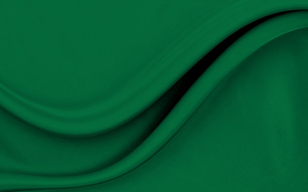 黑色的绿色缎面纹理，是白色的银色织物丝绸背景与美丽柔和的自然模糊图案。图片下载