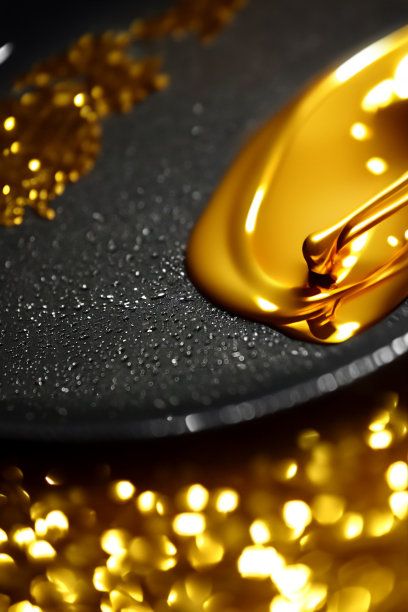 黄金首饰抽象的背景，融化的黄金和黄金闪闪发光的图案图片下载
