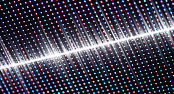 声波在LED纹理屏，数字视频墙背景。深蓝色和LED smd屏幕。网点网格渐变图案。图片下载