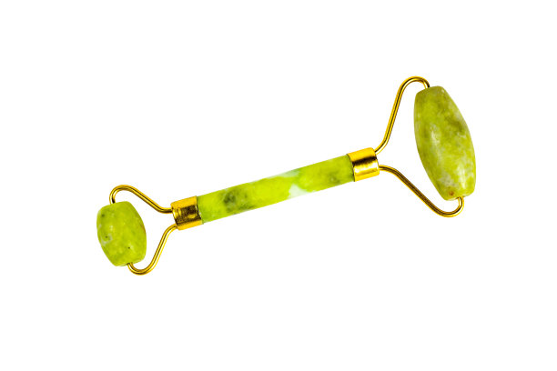 绿色石英石玉辊面部美容提升抗衰老按摩孤立在白色背景俯视图图片下载