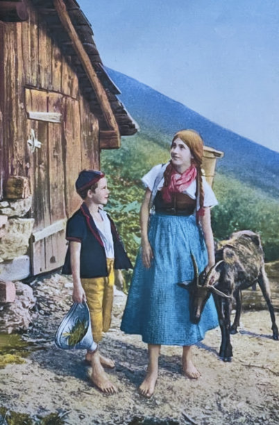 一个女孩和一个男孩站在伯恩斯·奥伯兰山上，牲口棚前牵着一只山羊图片下载