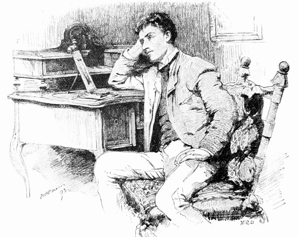 年轻人坐在桌子前想着他的爱人图片下载