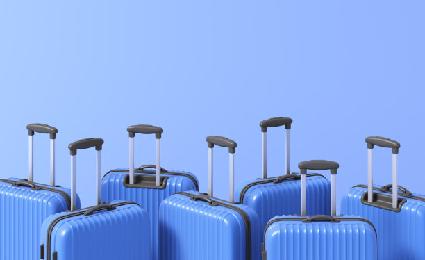 蓝色背景上的蓝色行李箱图片下载