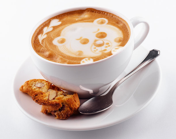 白杯卡布奇诺咖啡，上面有拿铁艺术图案的熊图片下载
