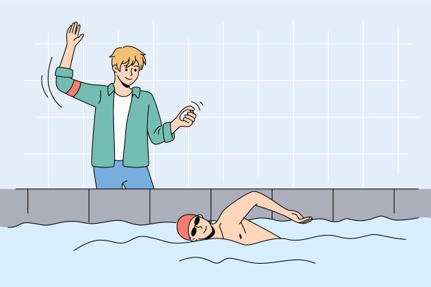 教练在教男子在室内游泳池游泳图片下载