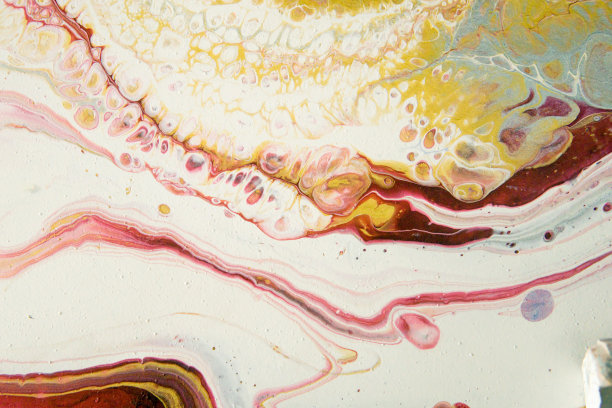 广泛的丙烯酸涂料。抽象的背景，以流动艺术的手法制作而成。时尚的彩色背景在温暖的颜色图片下载