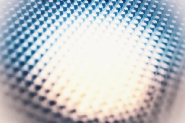 一种抽象的图形背景图像，显示物体纹理的蓝色梯度反射。图片下载