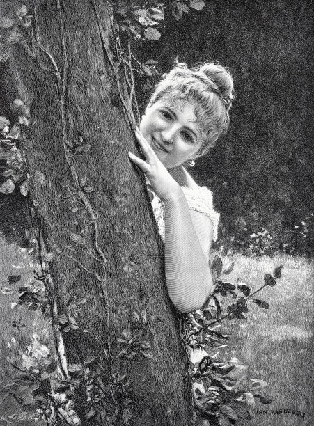 年轻漂亮的女人从树后向外张望图片下载