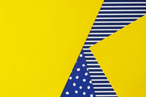 几何样式时装纸的纹理背景。黄色，蓝色，白色，条纹和圆点图案。俯视图，平铺图片下载