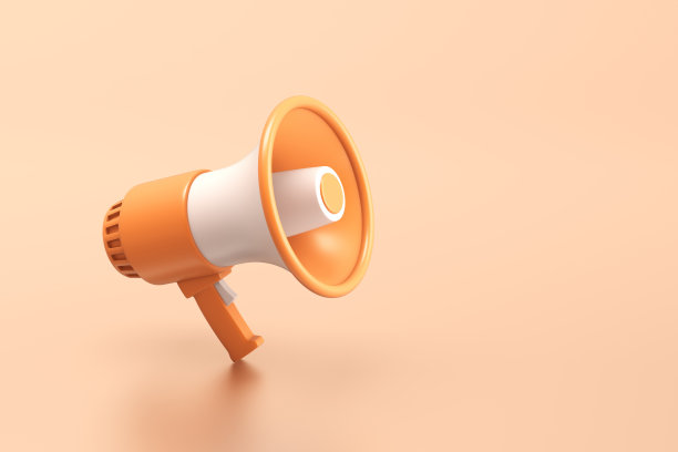 单橙色和白色的电动扩音器与一个手柄站在橙色的背景图片下载