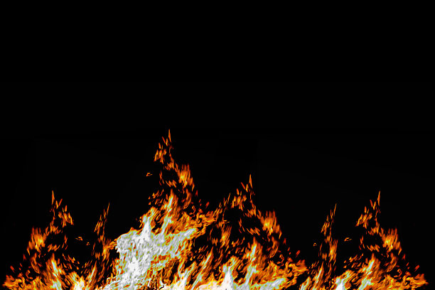 火-火热的背景-橙色的火焰，火花在黑色的背景。图片下载