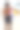 特写照片:赤裸上身的印度男子穿着冲浪短裤站在环礁湖水边的沙滩上，腋下夹着沙滩球和色彩鲜艳的沙滩玩具，看到有棕榈树的林地，侧影图片下载