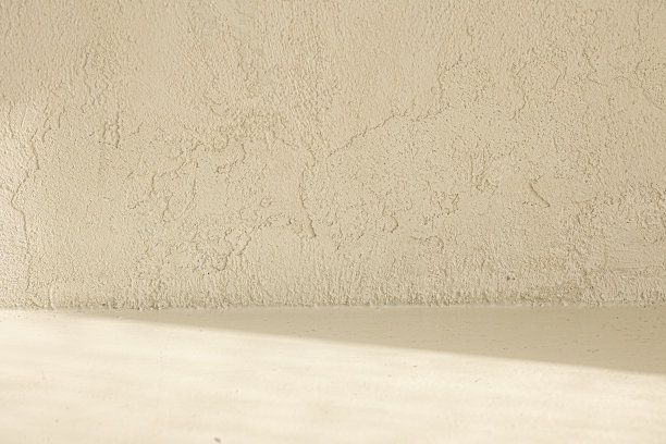 浅米色绘画背景与光和阴影在墙上。图片下载