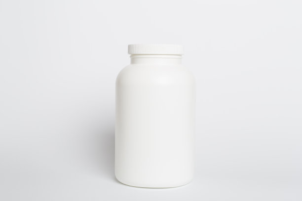 彩色背景装维他命的塑料瓶图片下载