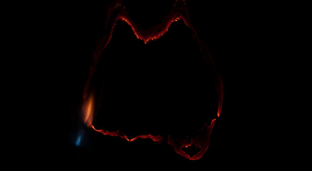 燃烧的纸，在黑色背景上发光的纸边图片下载