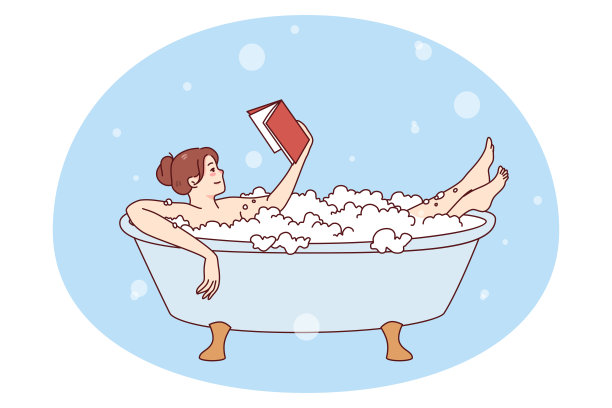 年轻女子在浴室里放松地看书图片下载