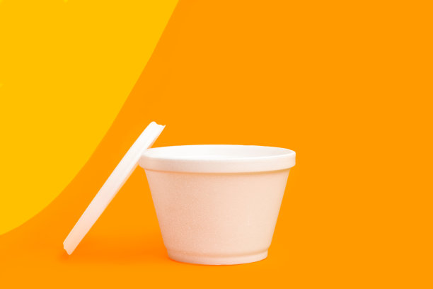 黄色和橙色背景的泡沫塑料食品保温容器图片下载