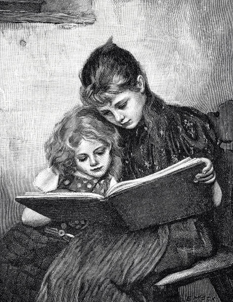 母亲和女儿正在读书图片下载