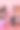 粉红色背景的购物车里有各种化妆产品和刷子。彩妆化妆品销售理念图片下载