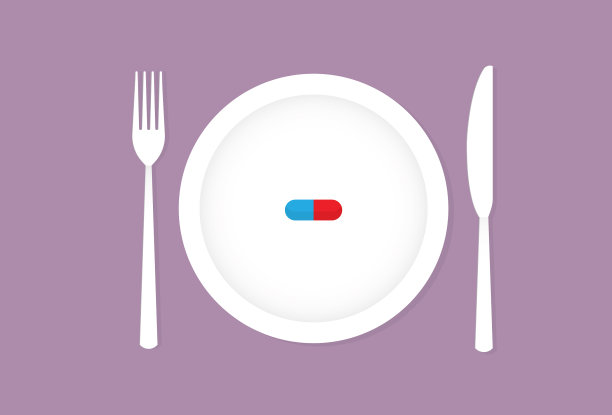 用刀叉把药片放在盘子里图片下载