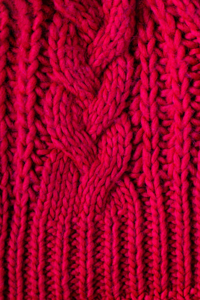 红色针织羊毛背景为您的设计。毛衣的针织织物图案图片下载