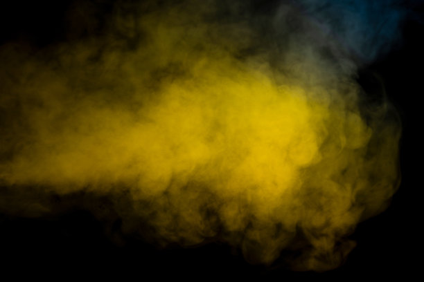 蓝色和黄色蒸汽在黑色的背景。图片下载