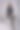 迷人的中年女人坐在孤立的灰色背景下图片下载