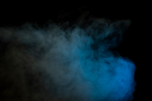 蓝色和黄色蒸汽在黑色的背景。图片下载