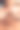 一个年轻的印度男子在一个蓝色的工作室背景下把润肤霜乳液涂抹在他的脸上的特写。帅哥在用防紫外线的防晒霜。在脸颊上涂抹面霜，使肤色健康，皮肤透明图片下载