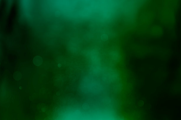 绿色圣诞散景闪光背景。图片下载