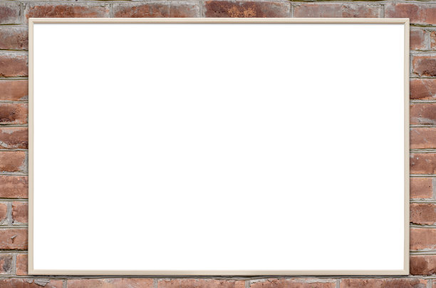 砖墙上挂着一个空木框。副本的空间。图片下载