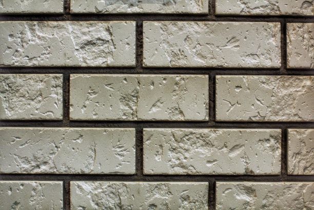 装饰花岗石、鹅卵石、石瓦、砖墙纹理背景。无缝图案背景。精心制作的现代砖墙外墙。房屋外部用砂岩砌块瓷砖图片下载