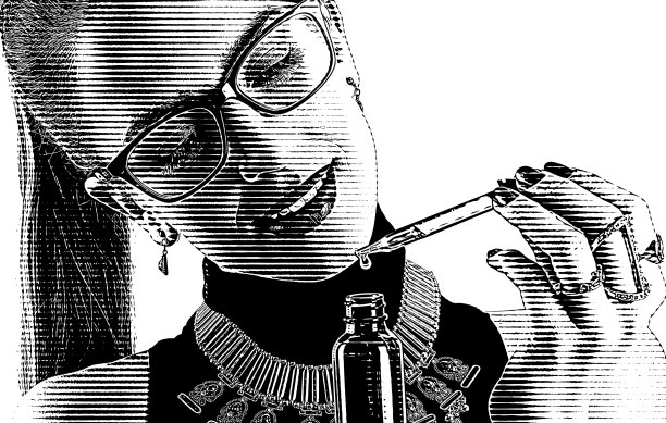 年轻女子使用CBD油瓶子和吸管图片下载