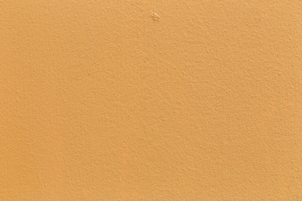 浅黄色的颜色与旧的垃圾墙混凝土纹理作为背景。图片下载